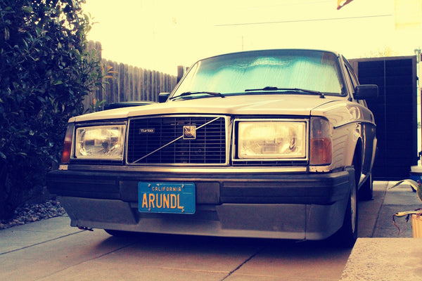 Volvo 242 is shown from the front.