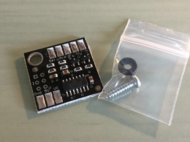 Buchka Engineering Wasted Spark Conversion Board - this photo shows the circuit board itself plus the screw and bushing included.